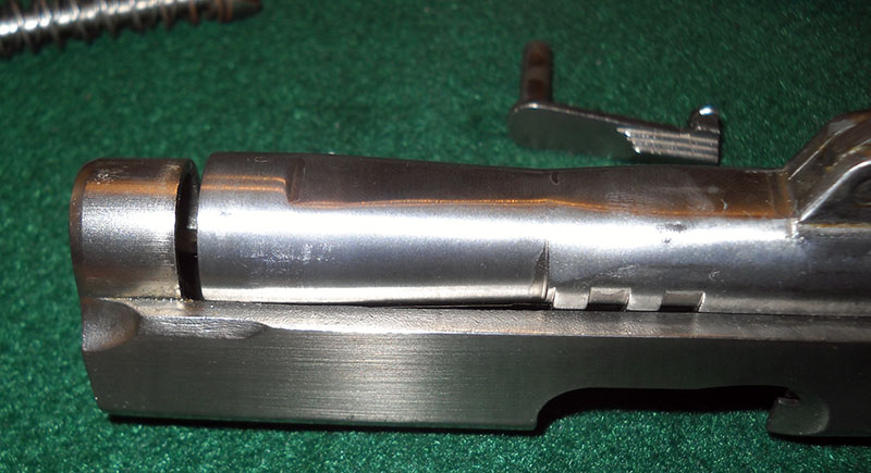 detail shot, showing flared DCM barrel and how it can't be inserted parallel into slide